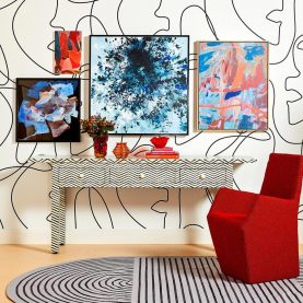 Bone Inlay Console with Zigzag pattern in a room with Red Chair